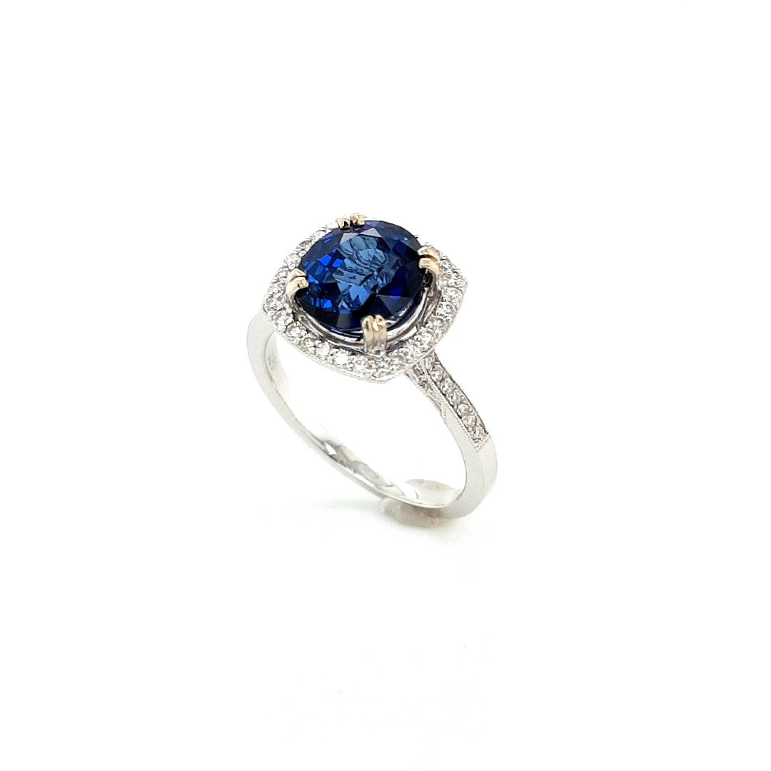 Blue Sapphire &amp; Diamond Halo Ring in 18k Gold