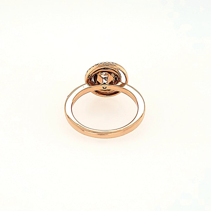 Eclipse Inspired Morganite Halo Ring with Diamonds in 14k Gold