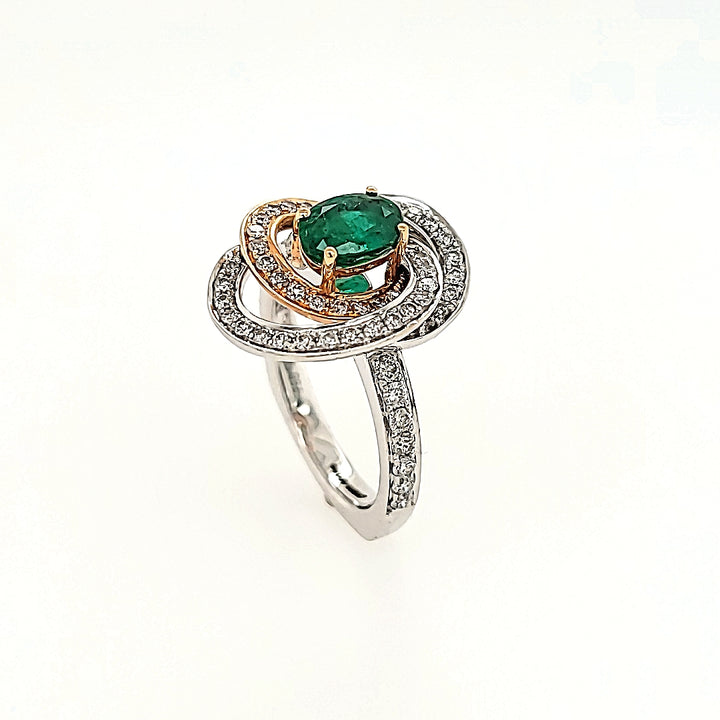 Swirling Emerald and Diamond Halo Ring in 18k Gold
