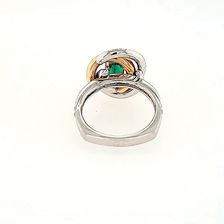 Swirling Emerald and Diamond Halo Ring in 18k Gold