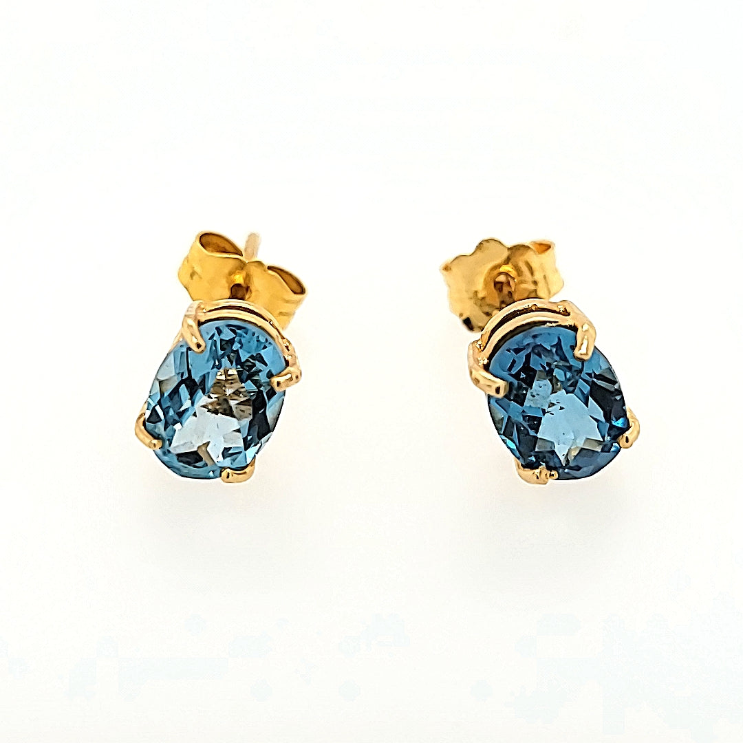 Oval Blue Topaz Studs in 14k Gold