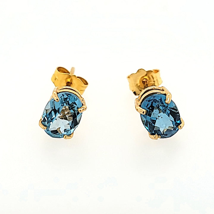 Oval Blue Topaz Studs in 14k Gold
