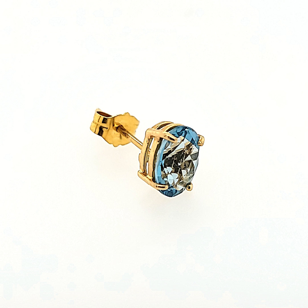 Oval Blue Topaz Studs in 14k Gold