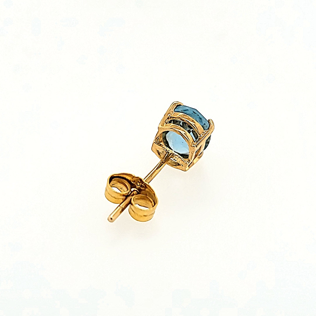 Oval Blue Topaz Studs in 14k Gold