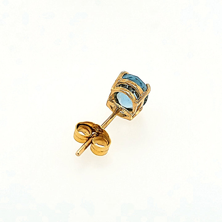 Oval Blue Topaz Studs in 14k Gold