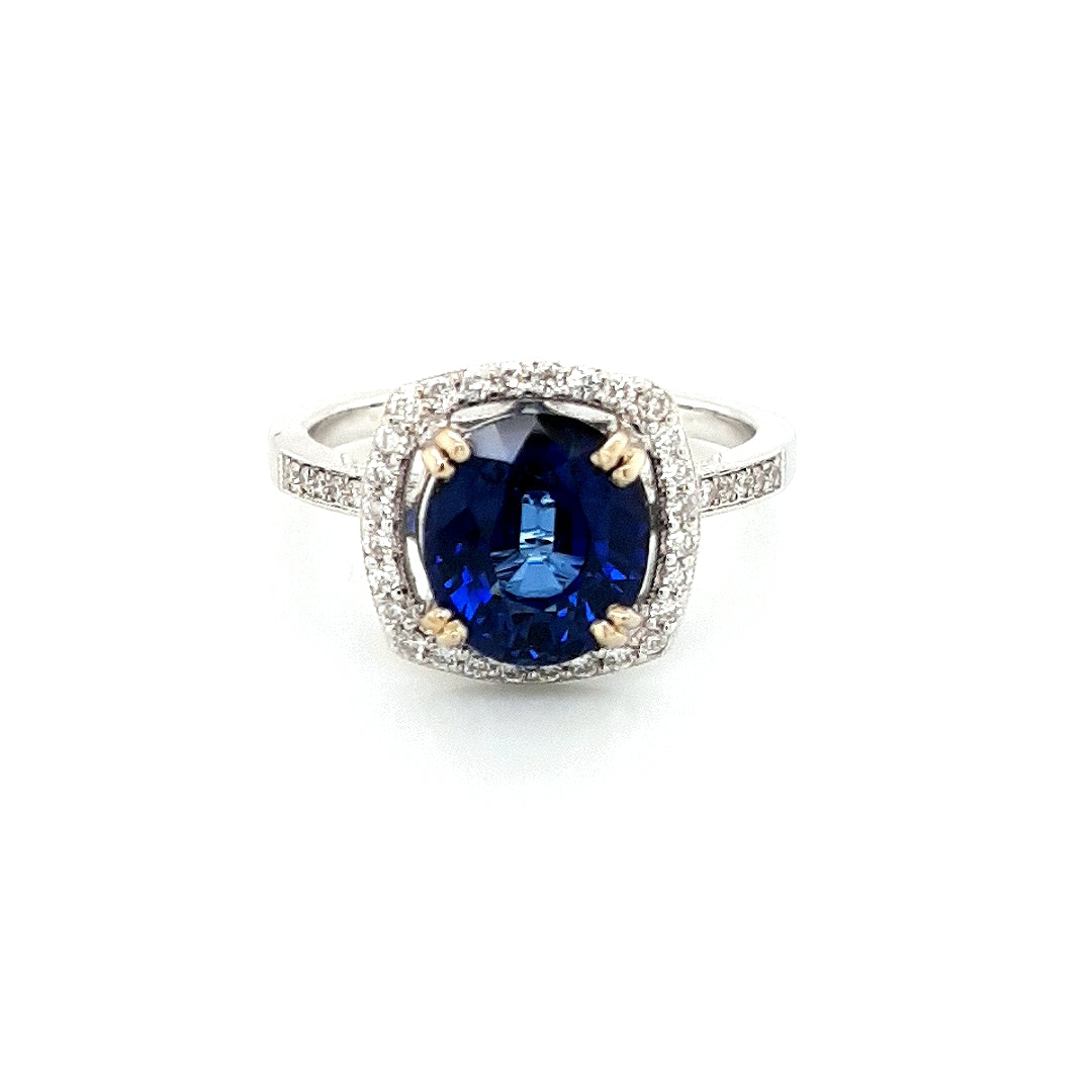 Blue Sapphire &amp; Diamond Halo Ring in 18k Gold