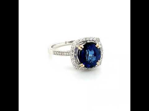 Blue Sapphire &amp; Diamond Halo Ring in 18k Gold